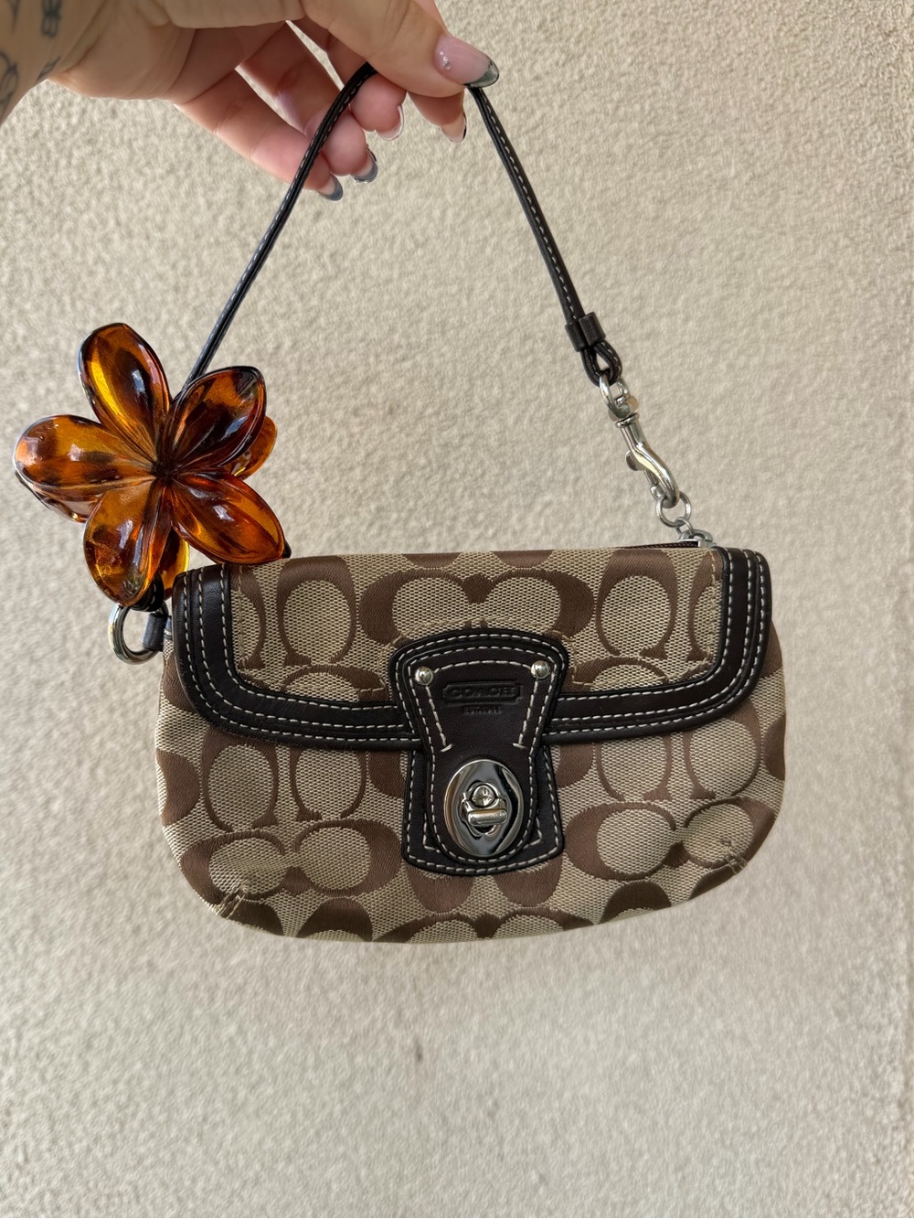 Coach Brown Signature Canvas Turnlock Wristlet with Amber Flower Charm